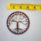 Measurement using ruler shows this brown wire wrapped trees compact size. Perfect for small spaces